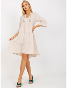 Fashionhunters Light beige oversize dress with ruffle and 3/4 sleeves